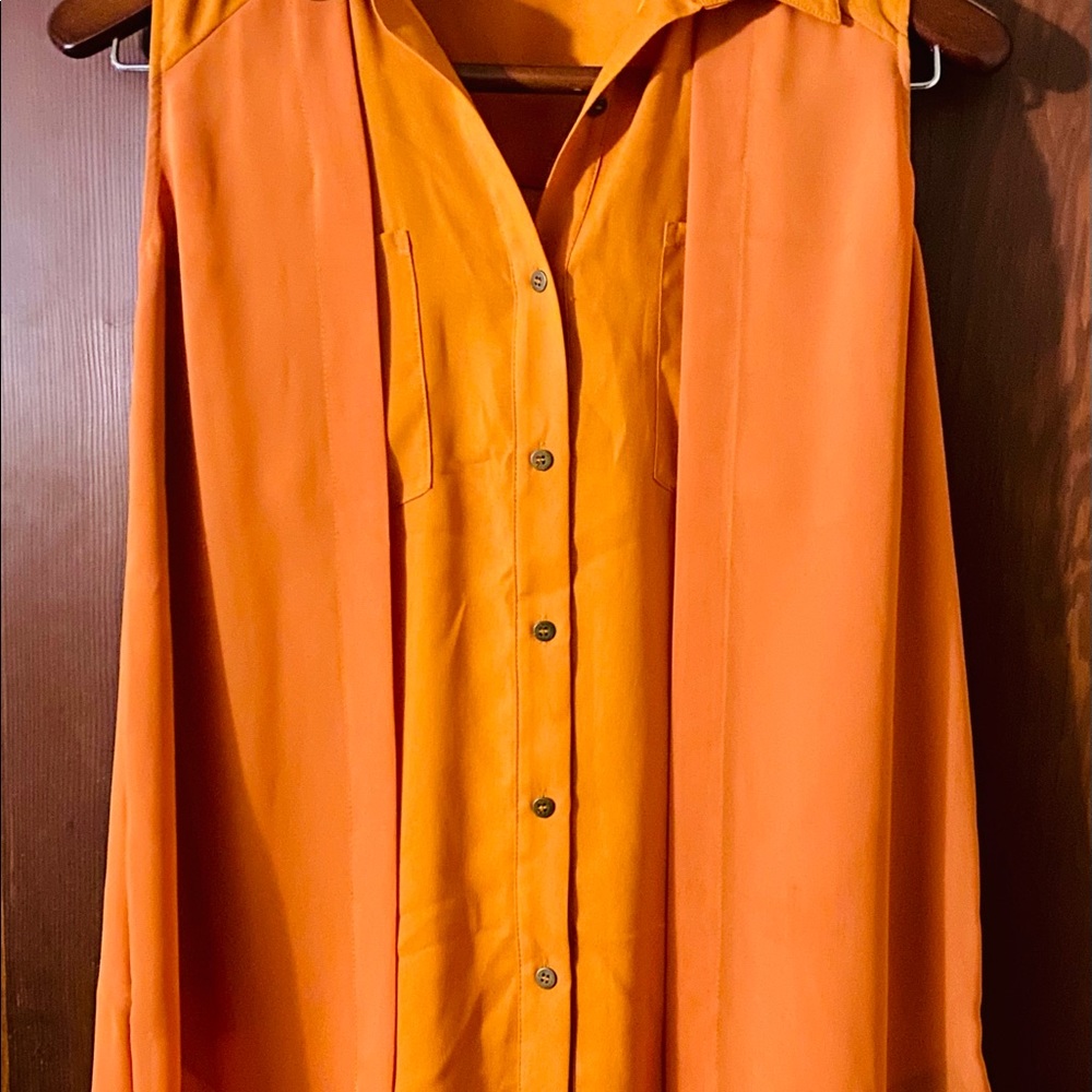 Chic, flowy, double layered button up burnt orange blouse by Kenneth Cole.